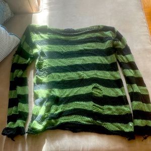green and black ripped detail sweater